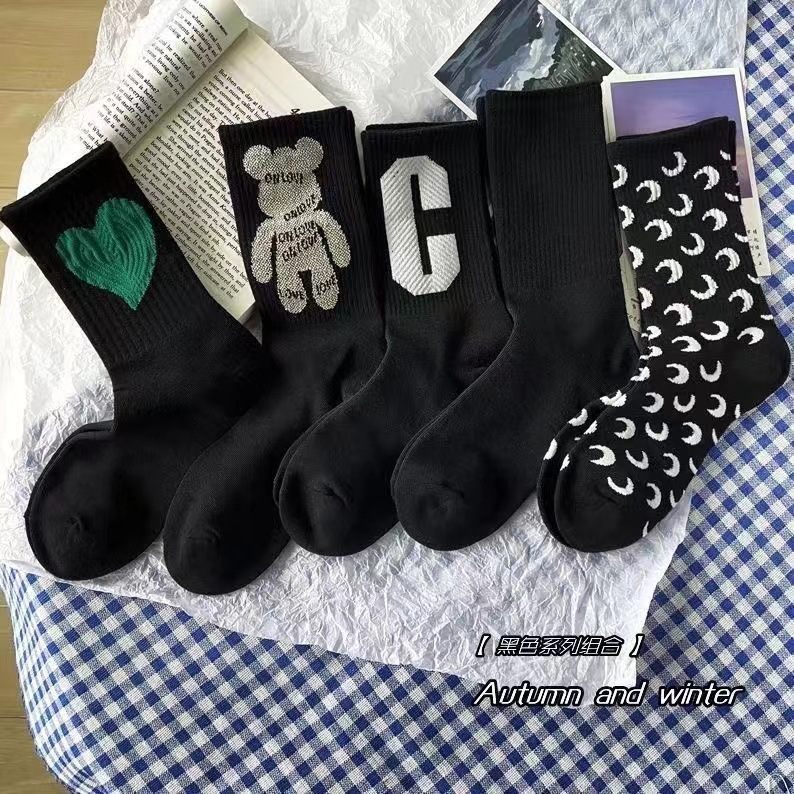 Black mid-tube socks autumn and winter new style ins trendy socks for women long tubes love internet celebrity solid color Japanese versatile