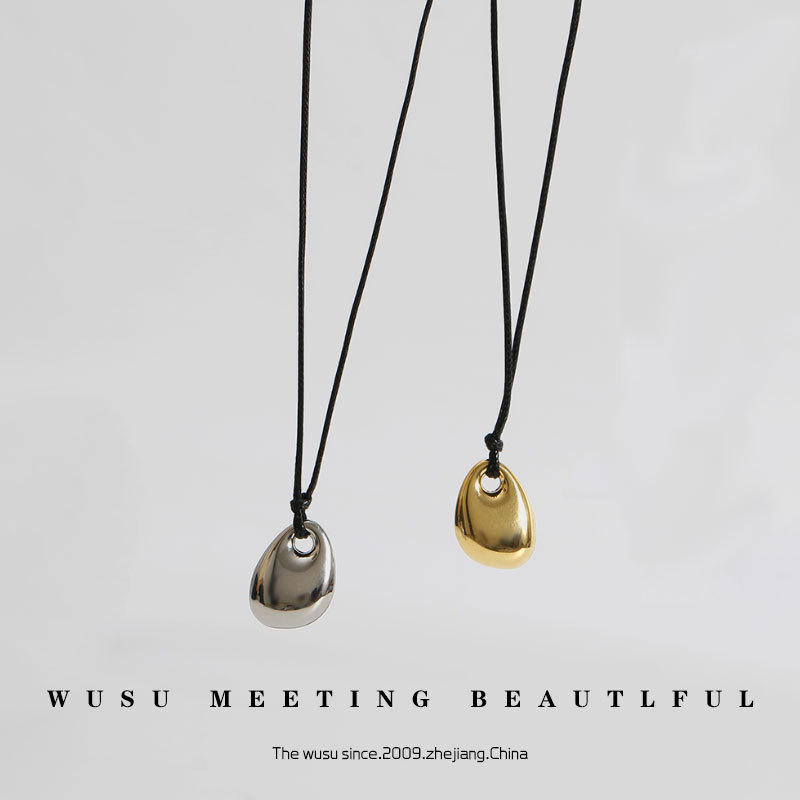 Titanium steel gold bean necklace clavicle chain long black rope leather rope sweater chain cross-border autumn and winter men and women couple pendant