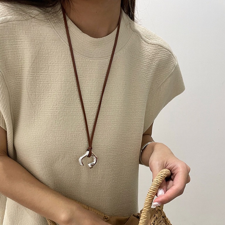 Korean Spring and Summer New Brown Leather Necklace Abstract Human Body Silver Pendant Sweater Chain Niche Light Luxury Collarbone Chain
