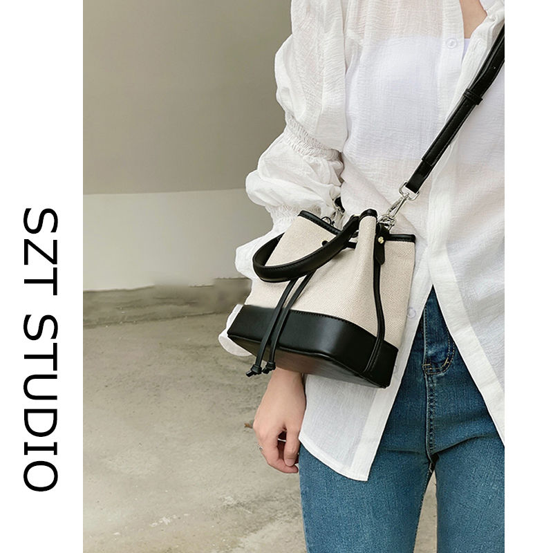 Canvas bucket bag women's new high-end niche design handbag commuter one-shoulder crossbody bag spring and summer