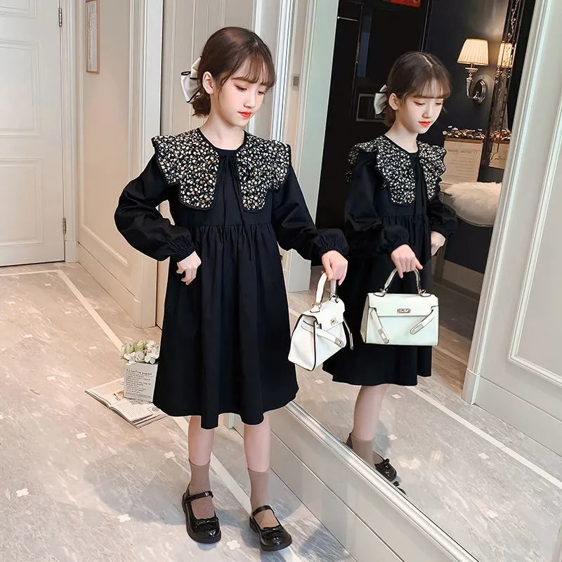 Girls' autumn dress 2021 new style foreign style Korean version middle school and college style long sleeved skirt with black broken flowers