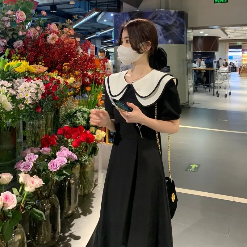 Doll collar dress summer new waist slimming temperament foreign style chic unique design sense long skirt